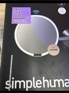 New, Simplehuman Wall Mount Mirror, color is rose gold, 8” in size